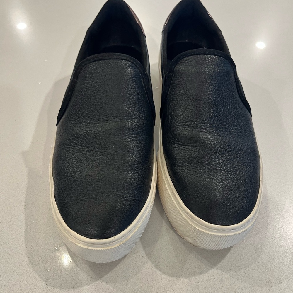 UGG women’s Black Leather Slip-Ons